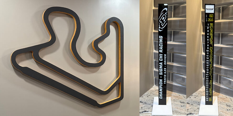 A wall art tracing of the Purdue Grand Prix track and a model of the Indianapolis Motor Speedway scoring pylon customized with the finishing order of the 2009 Purdue Grand Prix